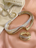 Ensemble de bijoux asymétrique bague, boucles et bracelet